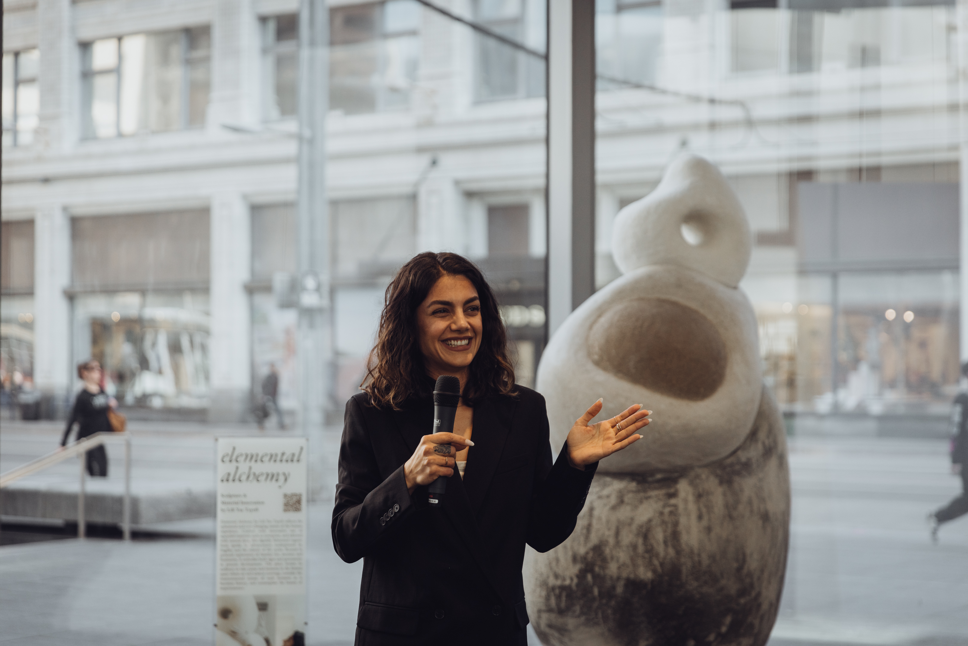 Lili speaking at her exhibition opening